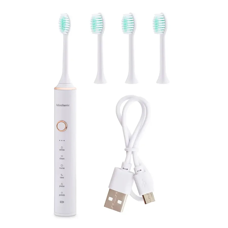 The AdvaSonic kit on a white ground: the handle with its head, three spare heads and the white USB cable