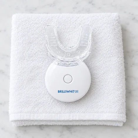 The BrilliWhite mouthpiece unlit, lying on a folded white towel, seen from above